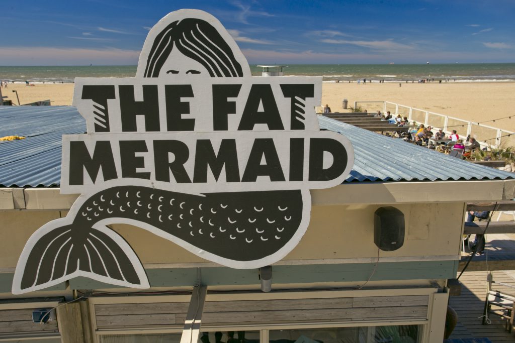 The Fat Mermaid logo on roof
